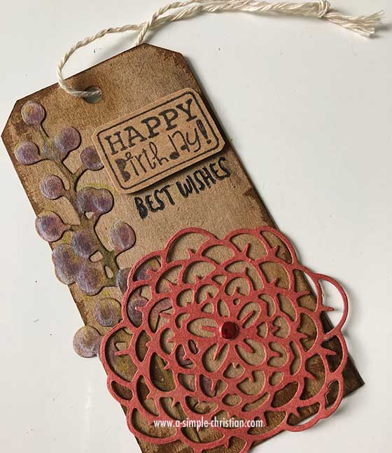 Recycled Art Tag created using carton box material and die cuts.